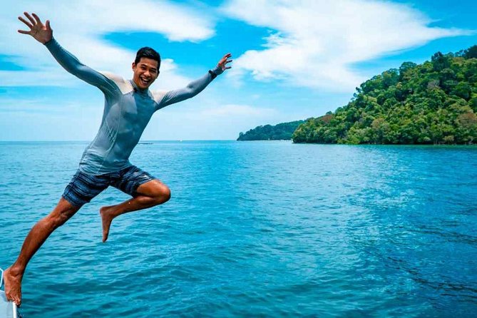 Fun Boat Snorkeling and Island Visit from Kota Kinabalu - Boarding the colorful Seatango fun boat